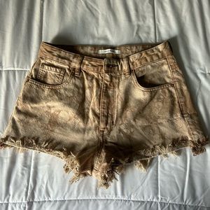 Tan denim shorts from Pacsun. High waisted and frayed at the bottom.